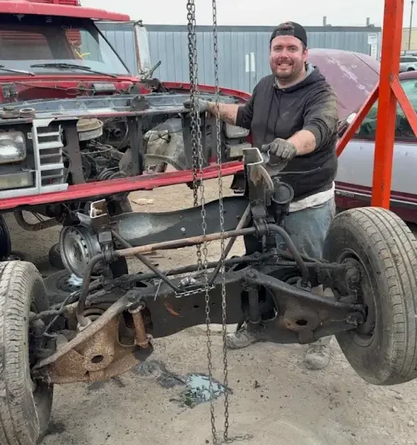 Old Glory Garage host working on a classic car